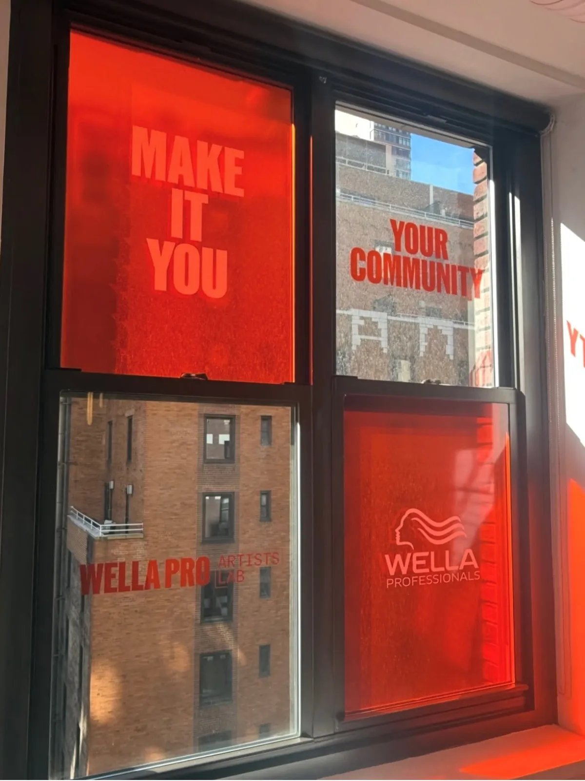 Wella Professionals MAKE IT YOU printed on windows at the Wella Pro Artists Lab Experience.