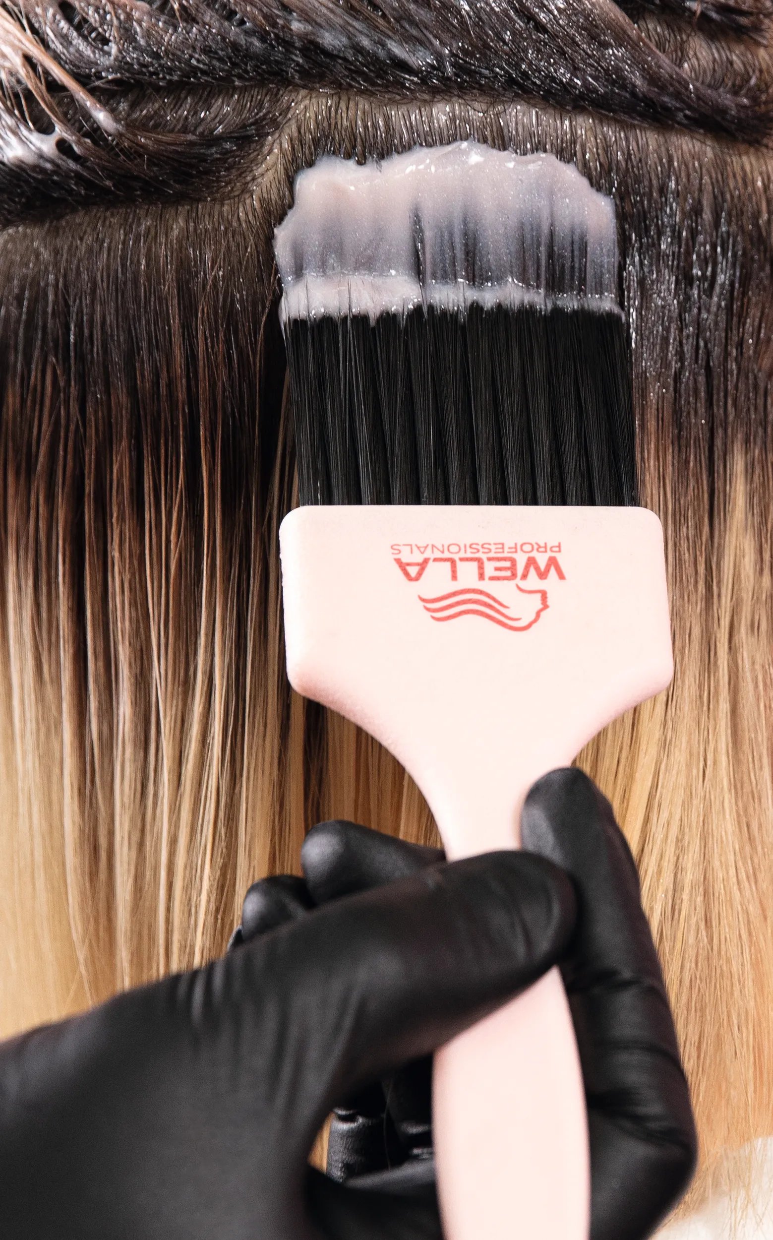 Brush hair color on dark roots, with Shinefinity