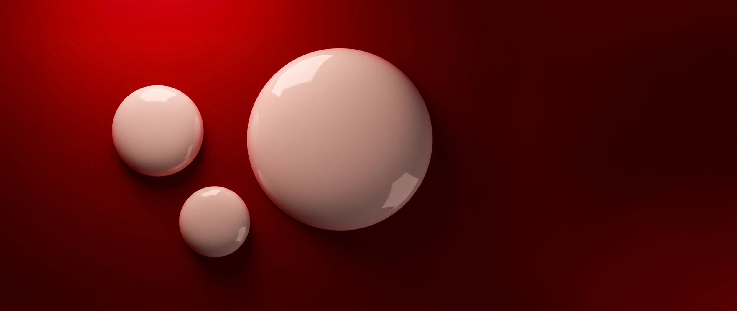 Close up of white droplets against red background.