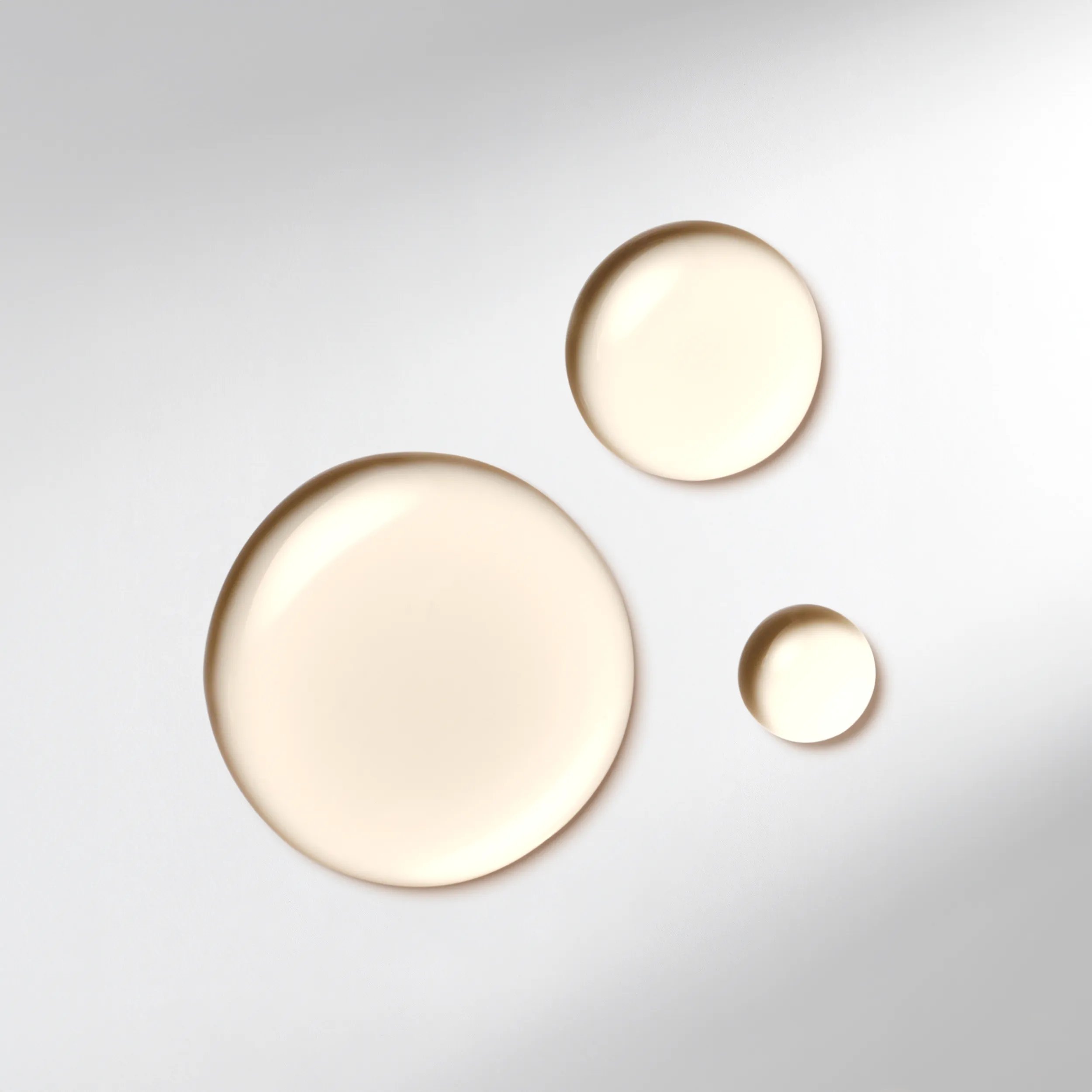 Three drops of Wella Professionals Ultimate Smooth Miracle Oil Serum. Text reads delicate oil serum.