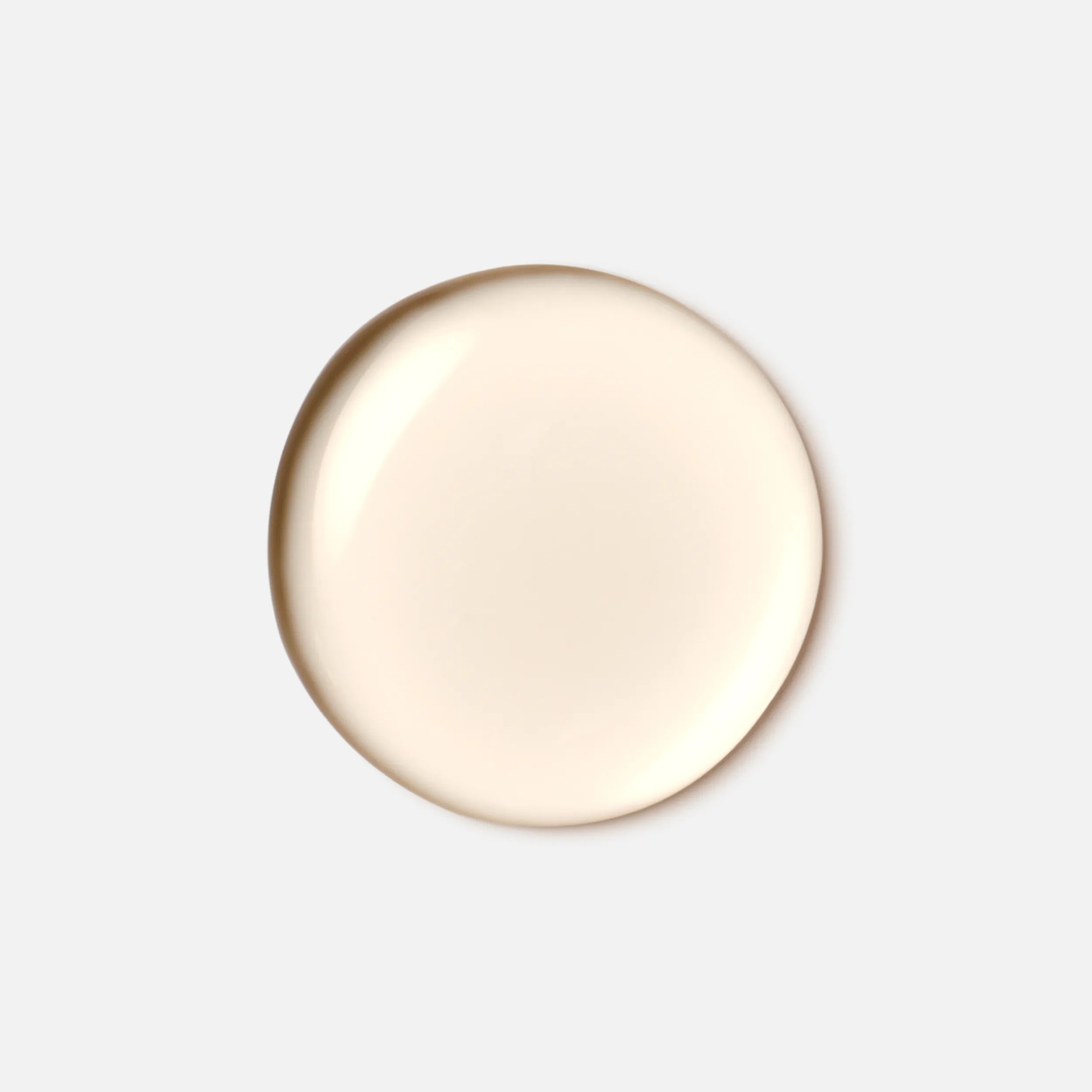 Drop of Wella Professionals Oil Reflections Light Luminous Reflective Oil to demonstrate texture.
