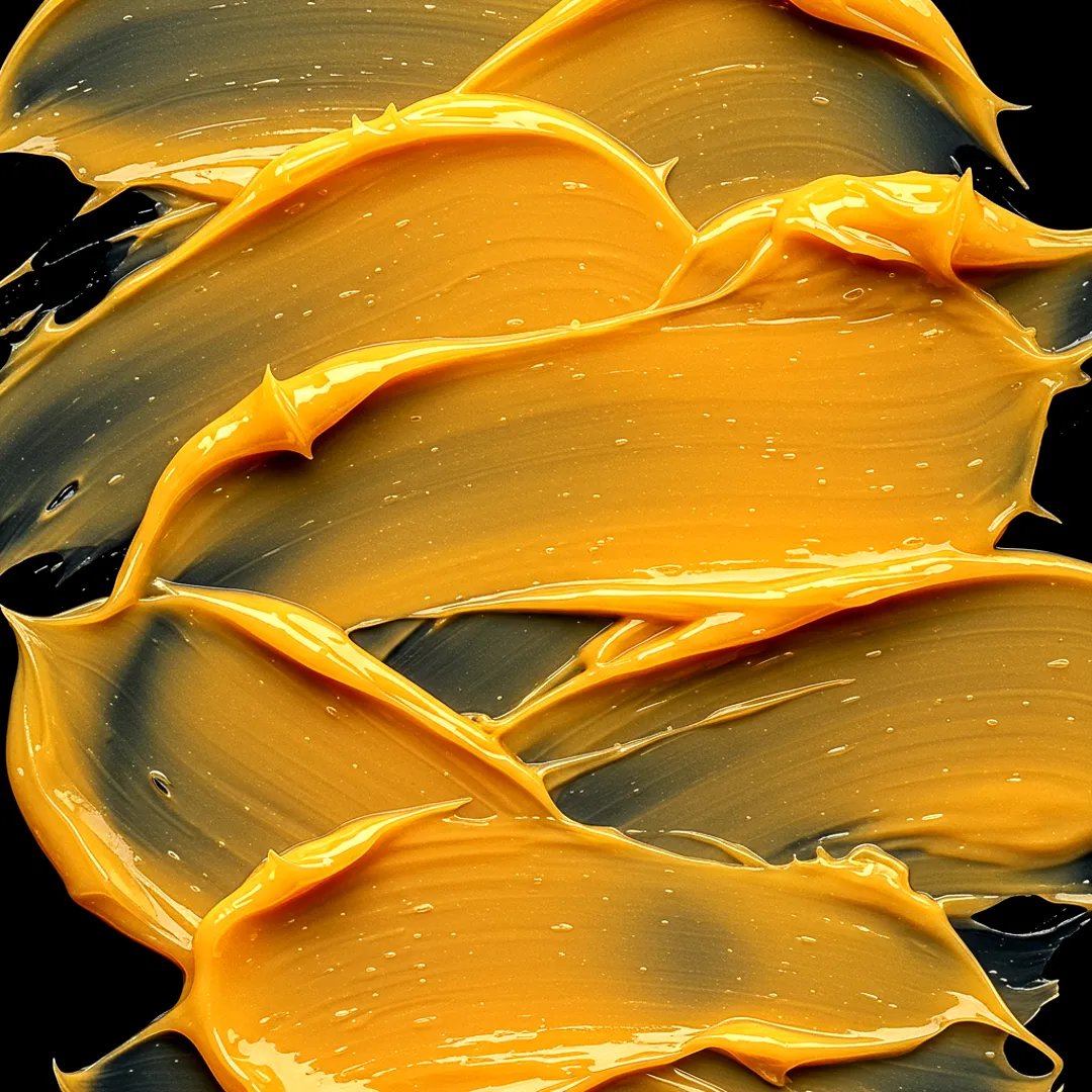 Bild von orangefarbenen Produkten, die auf schwarzem Hintergrund verschmiert sind.