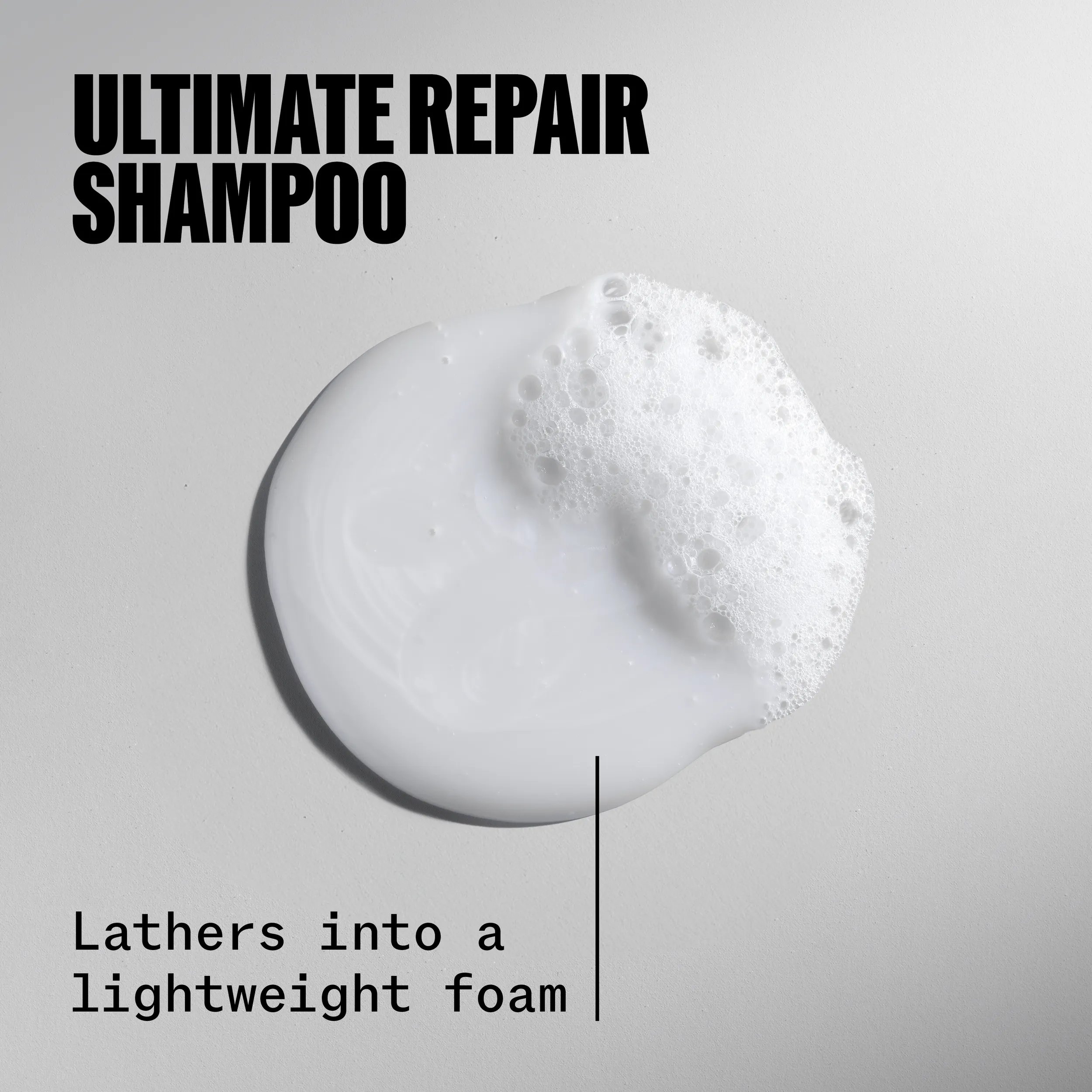 Drop of Ultimate Repair Shampoo. Text reads lathers into a lightweight foam.