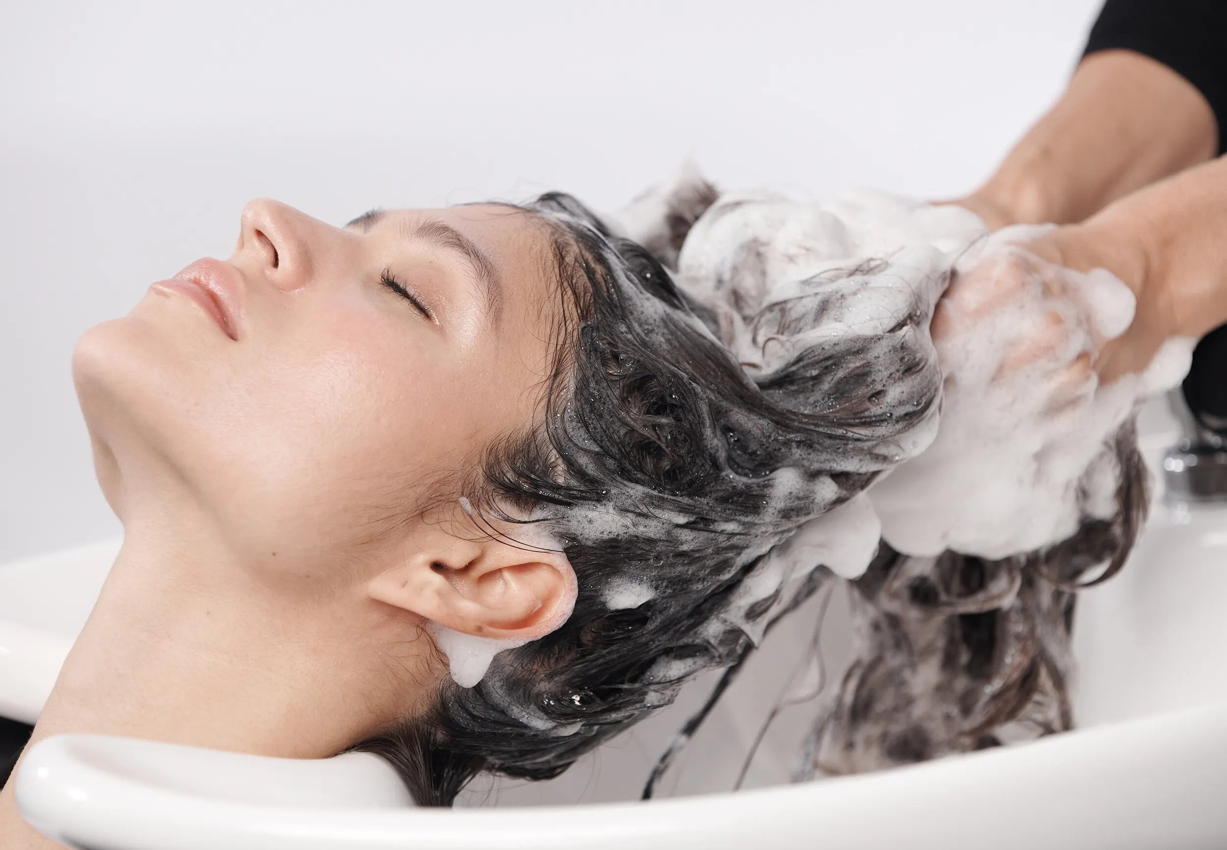 Model has hair washed with ULTIMATE REPAIR Shampoo. 
