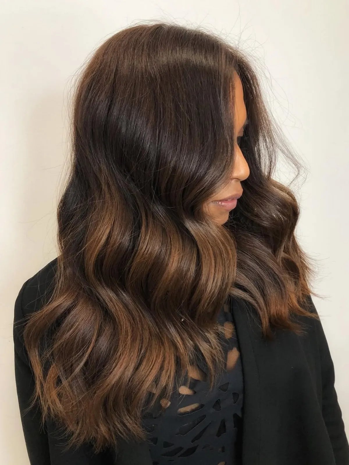Grown-out balayage refreshed with a chocolate brown color-depositing hair mask.