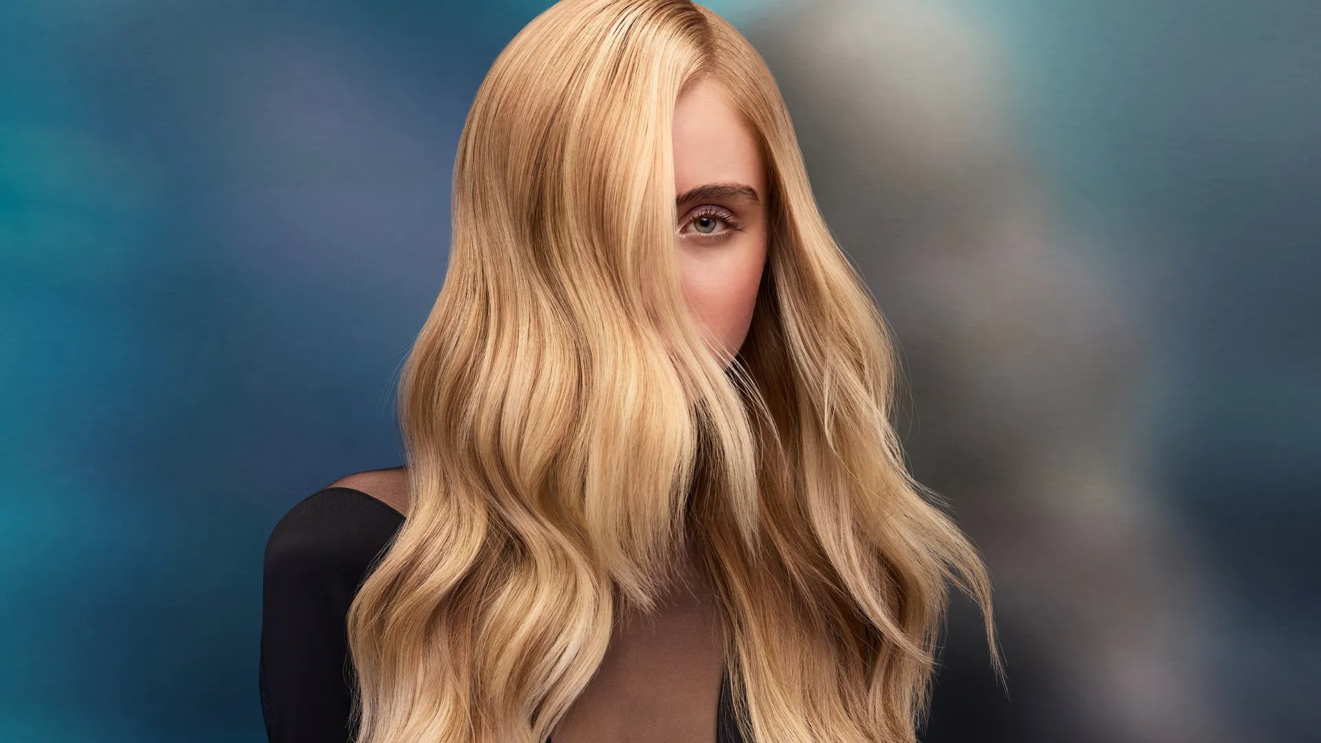 Model with long, loosely tousled, golden blonde hair.