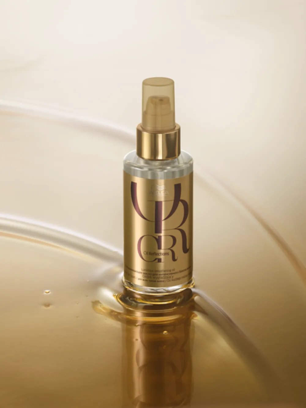 Wella Professionals hair oil serum bottle in a gold-toned packshot.