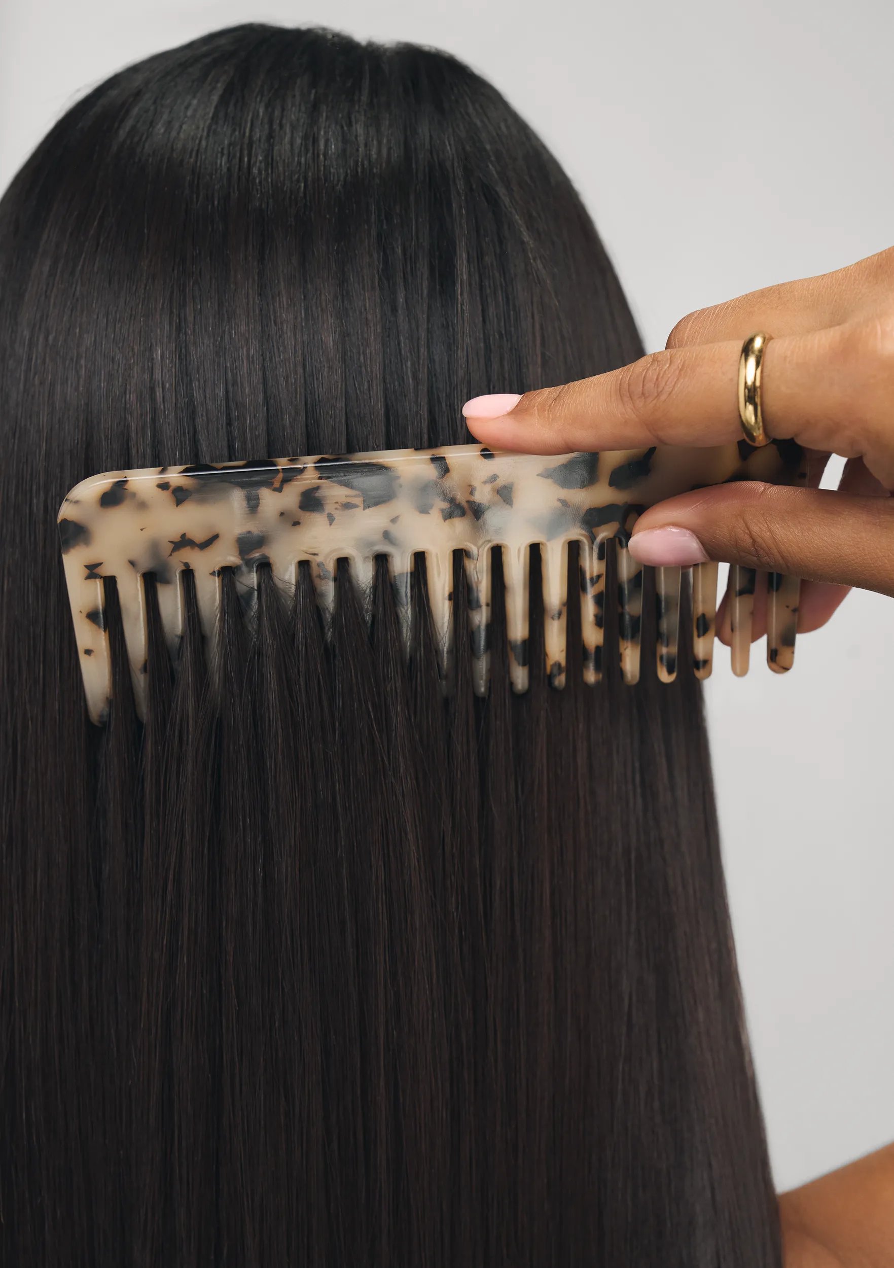 Model with curly brown long hair