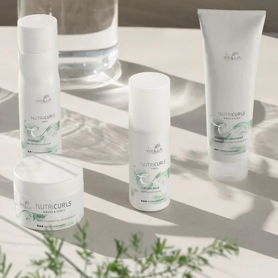 Collection of Wella NutriCurls products is on a white surface.