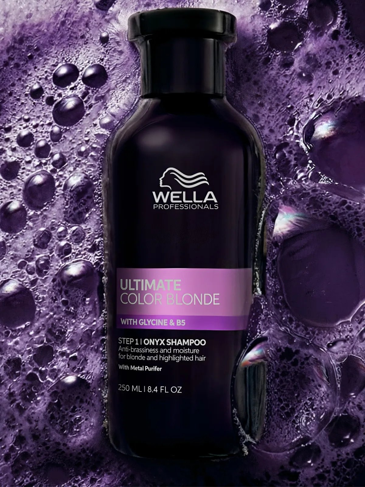 ULTIMATE COLOR BLONDE Onyx Shampoo surrounded by purple shampoo foam.