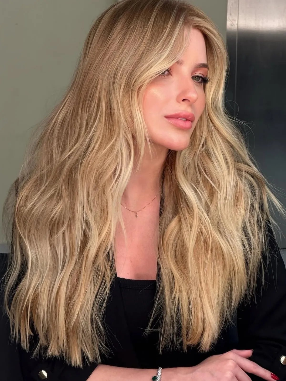 Model with butterscotch blonde roots and butter blonde mid-lengths and ends.