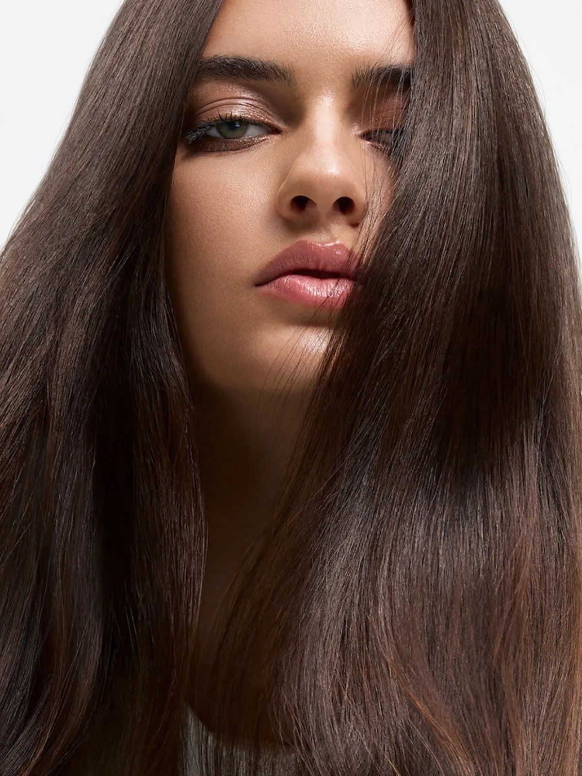 Model with long, glossy, smooth hair after a SmoothFiller™ service.