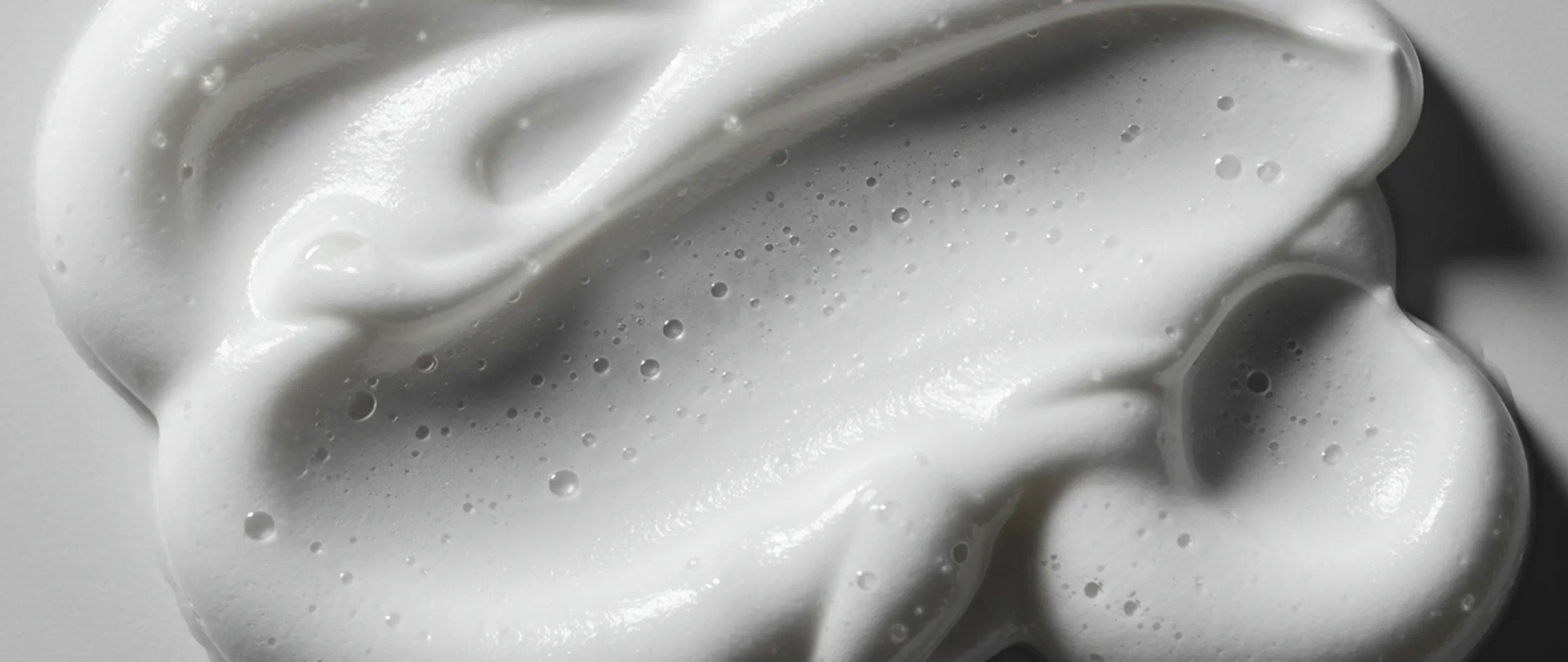 Close-up of white styling mousse