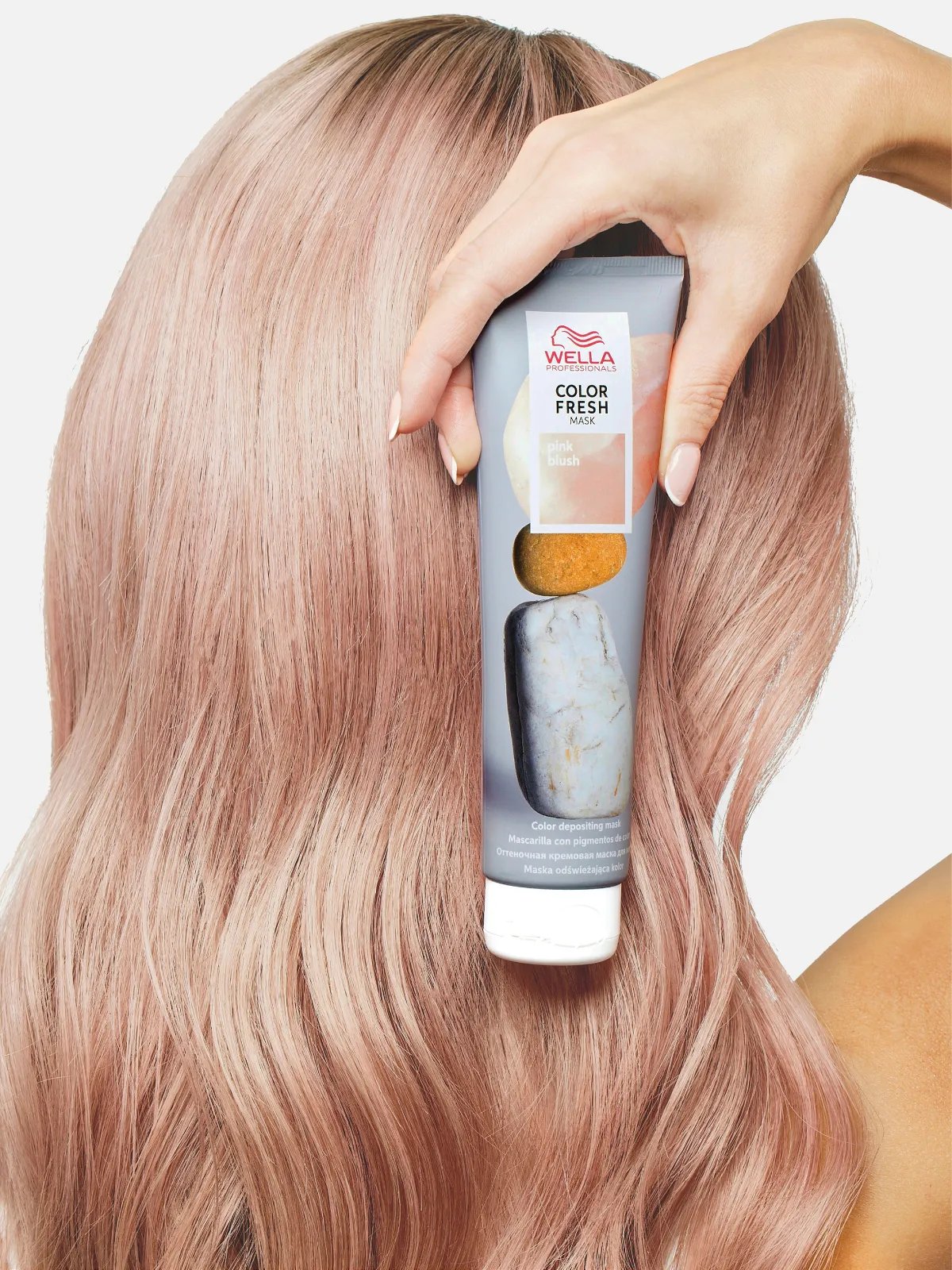 Model holds Color Fresh Mask in Pink Blush.