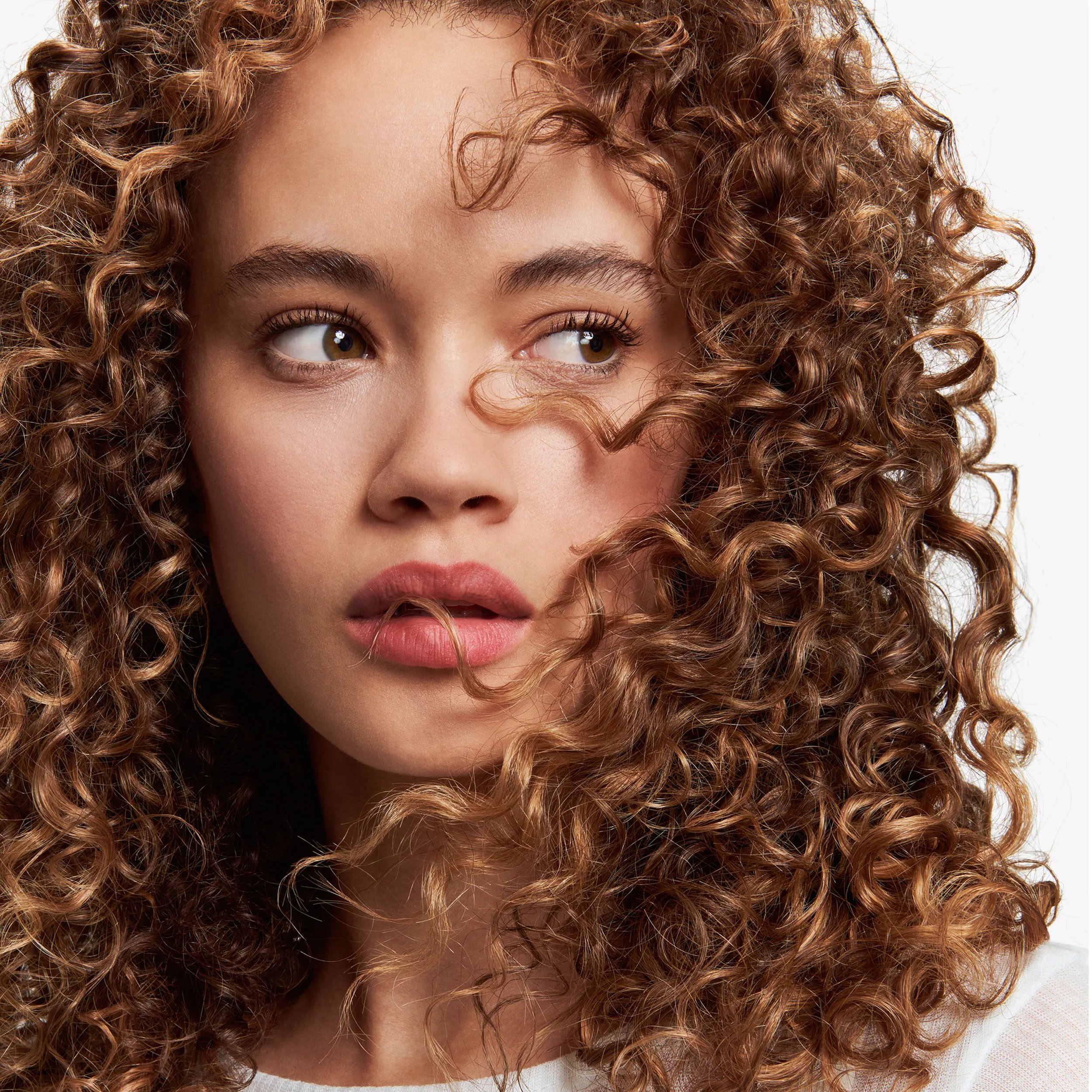 Model with brown curly hair