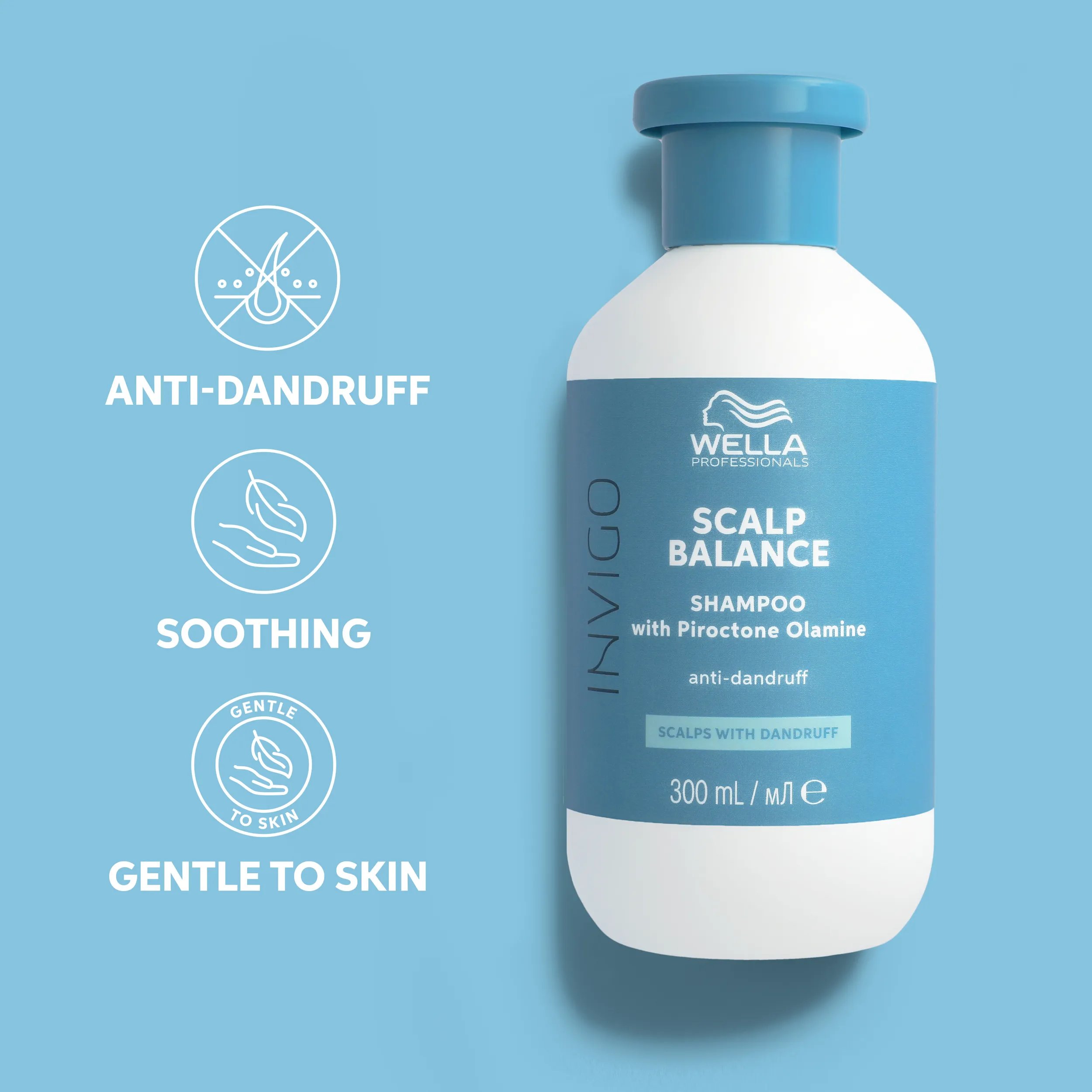 Photograph of a  hand with a bottle of Invigo scalp balance anti-dandruff Shampoo beside text which says 'soothing, gentle to skin, anti-dandruff'.