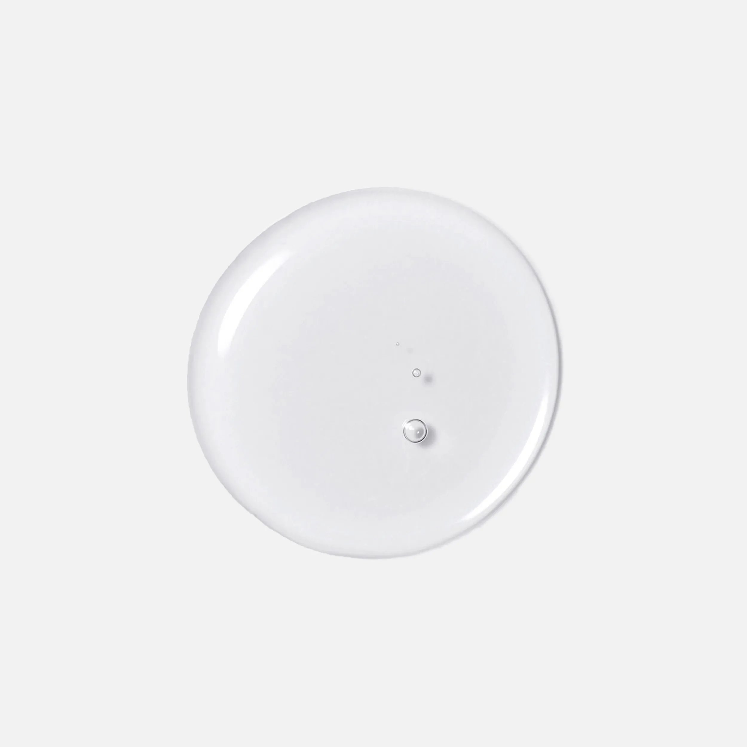 Drop of Wella Professionals Oil Reflections Luminous Reveal Shampoo to demonstrate texture.
